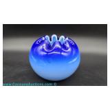 A cobalt to light blue ombré satin glass rose bowl with crimped rim and hand-painted gold and black 