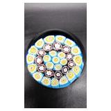 Millefiori paperweight with tightly packed canes in blue, yellow, and red, dated in the 1990s. 