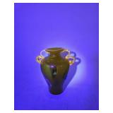 Hand-blown uranium glass vase with applied handles and internal floral motif, dating to the 1940s an