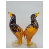 Pair of Murano-style art glass falcons in amber with black speckled millefiori and clear bases, attr