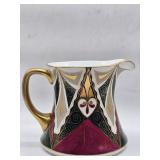  This porcelain pitcher in the Alhambra pattern by Victoria Austria features the same elaborate mult
