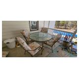 Four outdoor chairs with a glass-top bar table; measures 70" x 38" x 40"