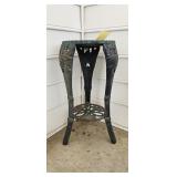 Heavy metal plant stand with floral design; measures 25x12"