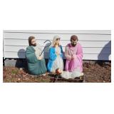 Four Empire blow mold nativity figures including Mary, Joseph, and baby Jesus. 