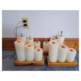 Group of electric candle lights on wooden bases, in working condition; measures 11" x 10"