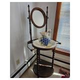 Wooden washstand with mirror and ceramic pitcher and basin featuring blue floral design; measures 22