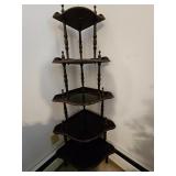 Dark wood Victorian style corner whatnot shelf or etagere with five shaped tiers, turned spindle sup