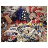 Group of patriotic-themed decorations including signs, ribbons, and floral picks. See pictures for d