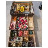 Group of sewing supplies including scissors, buttons, and thimbles