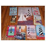 Coastal themed fabric flag assortment including lighthouse and sailboat designs, a Be a light to the