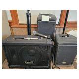 Group of audio equipment including Kustom speakers, Samson mic cables, and a microphone stand