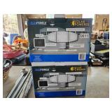 Two Sunforce solar powered motion sensor lights with adjustable lamp heads and weather-resistant des