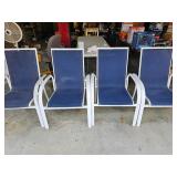 Four white metal frame patio chairs with blue mesh seats