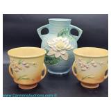 Dating to the 30s to 40s featuring a Roseville style blue double handled vase with molded white wate