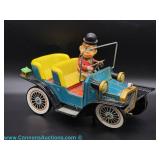 A vintage lithograph wind-up toy automobile dating to the mid 20th century.
