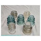 Six glass insulators including Whitall Tatum and Armstrong