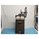 Dazey Churn & Mfg. Co cast iron butter churn with hand crank and spout; measures 31" x 11" x 10"