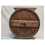 Antique wooden Blizzard butter churn lid in a rustic farmhouse style dating to the late 19th to earl