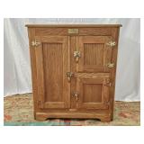 White Clad oak ice box by Simmons Hardware Co. with brass hardware; measures 35" x 31" x 20"