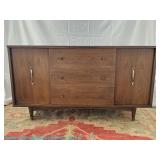 Mid-Century wooden sideboard with three central drawers and two side cabinets; measures 58" x 32" x 