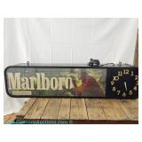 Marlboro advertising clock with electric cord, lights up and please preview for working condition; m