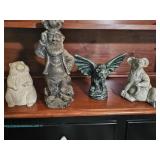 Four composite garden animal and figure statues including a seated rodent, a standing bearded man wi