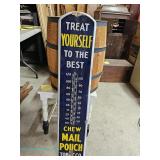 An American Mail Pouch Tobacco advertising thermometer from the 40s–50s features a blue metal face w
