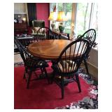 Wooden round table w/1leaf 49” dia. Chairs not included 