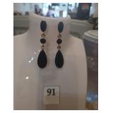 Blue earrings on gold