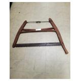 Vintage wood-framed buck saw