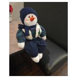 Snowman sitting