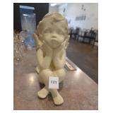 Angel resting against column