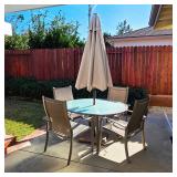 Patio table with umbrella and chairs