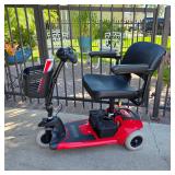 Mobility aides, including this Pride Travel Pro scooter