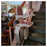 Mobility aides, including this power stairlift for switchback staircase