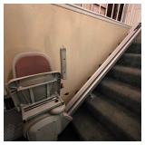 Mobility aides, including this power stairlift for switchback staircase