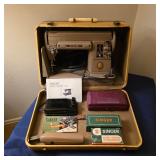 Vintage Singer 301A sewing machine with original case, manual, and accessories