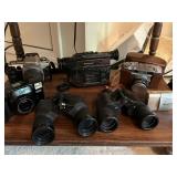 Binoculars, Cameras and Palmcorder. 