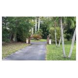 Hidden Drive Way Leading to a Mediterranean-style South Florida Estate to a Mediterranian