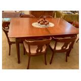 Dining table, has 3 additional leaves and 9 chairs, in great condition