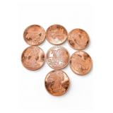 Seven Copper-Tone Coins
