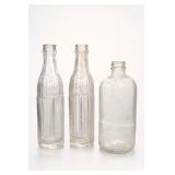 Three Clear Glass Bottles