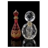 Red and Clear Glass Perfume Bottles