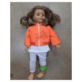 Brunette Doll With Orange Jacket and White Pants