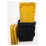 Stacked Black Storage Totes With Yellow Lids