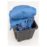 Plastic Bin With Blue Jeans and Shirts