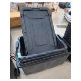 Stacked Black Plastic Storage Totes With Lids