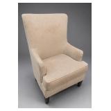 Beige Upholstered High-Back Armchair