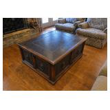 Ornate wooden coffee table with multiple drawers