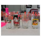 Four Coca-Cola-Related Promotional Glasses